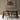 a wooden dining table and chairs in a room with a hanging rattan lampshade